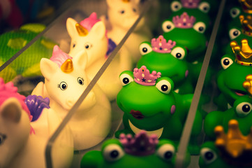Unicorn and frog different bathing ducks