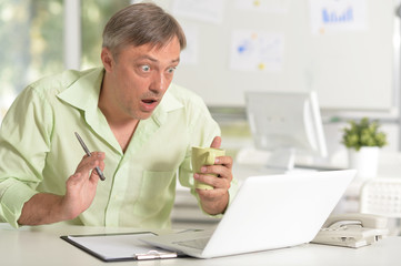 Man working with laptop in the office