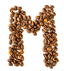 M letter made from coffee beans isolated on white background