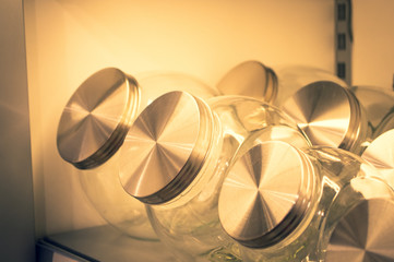 Storage jars of glass in a shelf