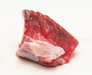 slices of raw meat on a white background