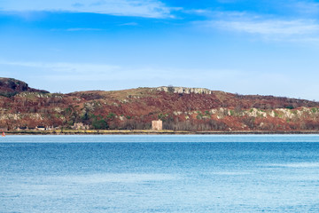 Little Cumbrae from Portencross North Ayrshire on a Cold Day in Scotland and the Ancient Ruins of the Old Castle.