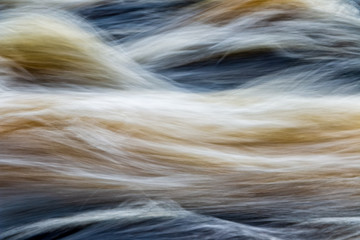 fast flowing water in mountain river in sweden