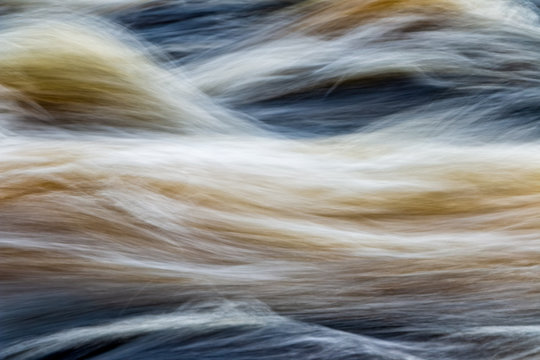 fast flowing water in mountain river in sweden
