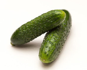two cucumbers on a white background