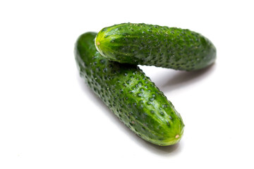 two cucumbers on a white background