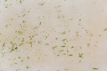 background, finely chopped green dill on a kitchen board