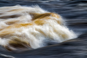 fast flowing water in mountain river in sweden