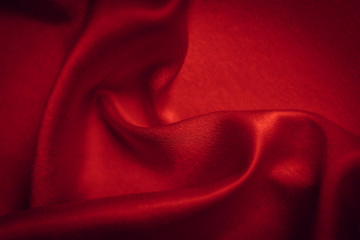 Abstract red background, rippled silk with shape of heart