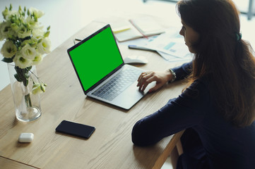 Portrait of a serious businesswoman using laptop in office