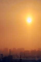 dawn in the city in the winter among high-rise buildings