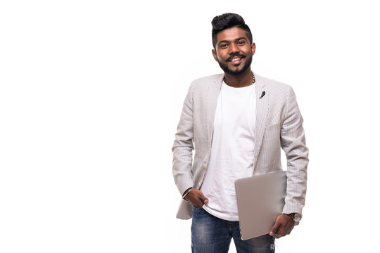 Young handsome indian hipster man holding laptop isolated on white background