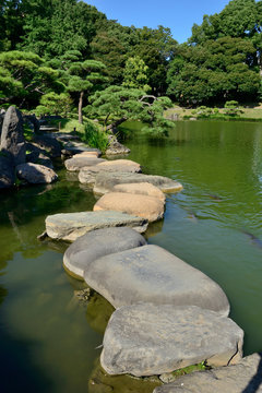 Bridge made of stones in a Japanese garden 