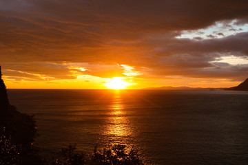 Fototapeta na wymiar Cloudy coastal sunrise scene in Santona, North Spain