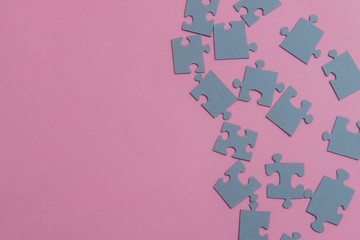 Paper puzzles on a pink background