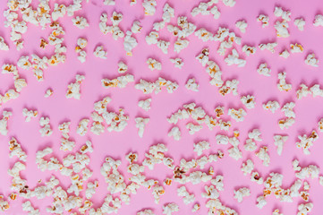 Popcorn pattern on pink background. Top view