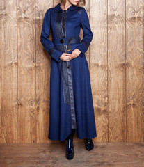 Women's jacket, blouse, coat, skirt and photomodel posing. Wooden floor. Fashion and design, luxury. Dark colored and patterned dress. Islamic fashion - Image