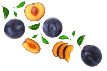 plums with leaf isolated on a white background with copy space for your text. Top view. Flat lay pattern