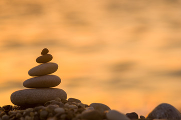 stack of zen stones on pebble beach