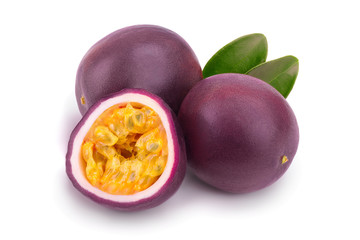 Two whole passion fruits and a half with leaves isolated on white background. Isolated maracuya