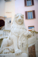 statue of a proud lion with shield
