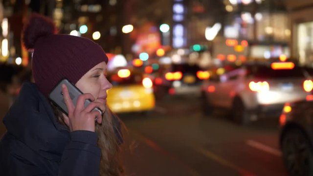 Young woman with her cell phone in the streets of New York