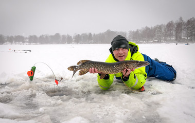 Winter pike fishing on Swedish lake