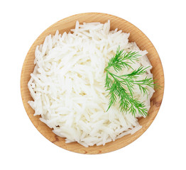 rice in a wooden bowl isolated on white background. Top view. Flat lay