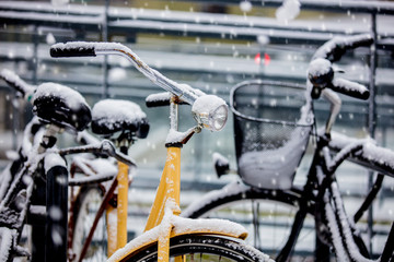 Fototapeta na wymiar Beautiful style bike in snow after high snowfall in Europe.