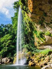 Fototapeta premium Stunning Misol Ha waterfalls in the lush rainforest of Chiapas, Mexico 