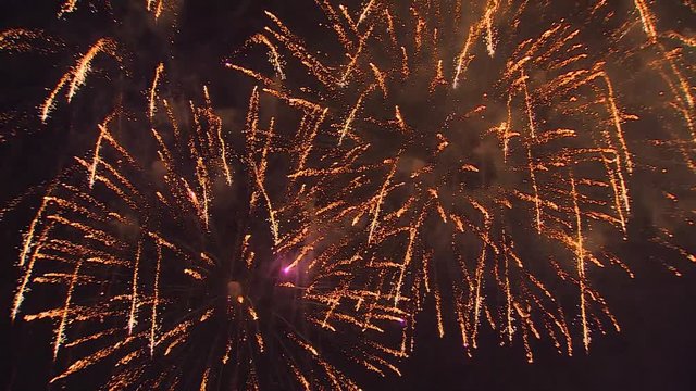 Closeup of festive fireworks in the night sky. Multi-colored salute salvos, very beautiful, maybe anywhere, without people in the frame.