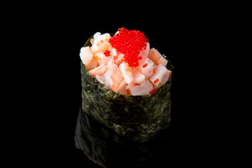 Gunkan Maki Sushi with prawn and caviar tobiko on black background. Sushi menu. Japanese food.