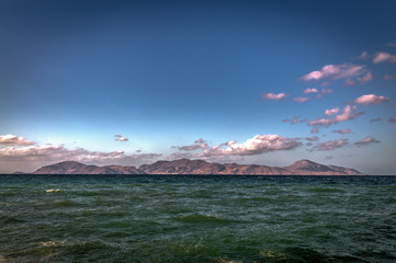 Sunny view from Alikes beach near Tigaki to island of Pserimos. Island of Kos, Greece