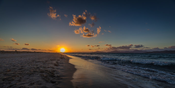 Sunset on sandy Alikes beach near Tigaki  with dramatic cloudy sky. Island of Kos, Greece