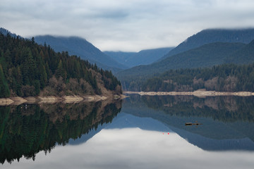 Fototapeta na wymiar Mountain lake, calm with glass reflection