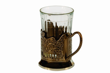 Closeup view of faceted glass in a metal cup holder isolated on  white background with clipping path. Beautiful background.