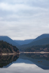 Fototapeta na wymiar Mountain lake, calm with glass reflection