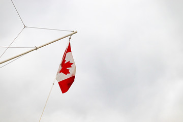 Canadian flag on a pole floating isolated