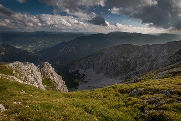 Scenic sunset view from Dambocksteig trek on valley of Rax plateau with idyllic, fresh, green, grassy meadow, near Klosterwappen, Schneeberg, Lower Austria