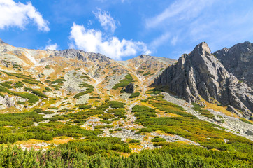 Hiking in High Tatras Mountains (Vysoke Tatry), Slovakia. Mlynicka Valley. On the way to Skok waterfall (1789m) (Slovak: Vodopad Skok). Sunny autumn day © katatonia