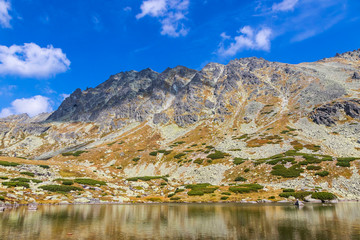 Hiking in High Tatras Mountains (Vysoke Tatry), Slovakia. Lake over Skok waterfall (Slovak: Pleso nad Skokom) (1801m). Mount Satan (2421m) on background © katatonia