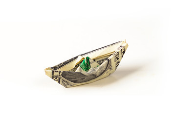 1 dollar banknote folded as a boat, finance concept