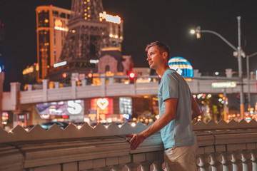 Young man exploring the strip of Las Vegas at night © Aerial Film Studio