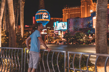 Young man exploring the strip of Las Vegas at night © Aerial Film Studio