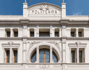Palace with semicircle white window  crossed by decorated columns.