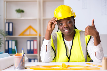 Young black architect working on project 