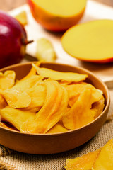 Dried Mango Fruit on Wooden Background. Selective focus.