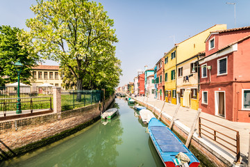 Obraz premium Colorful houses by canal in Burano, Venice, Italy.