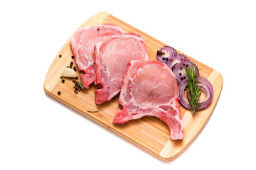 pork chop, steak, pieces of pork on a wooden board. isolate on white background