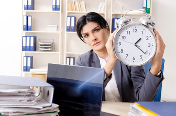 Middle aged businesslady unhappy with excessive work 